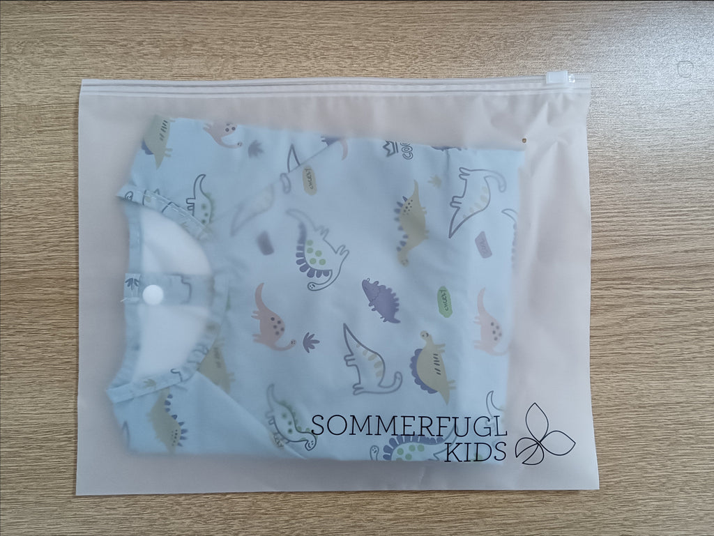 Jurassic Blue Waterproof Baby Smock Bib Long Sleeve — cat baby bib showing face and soft texture