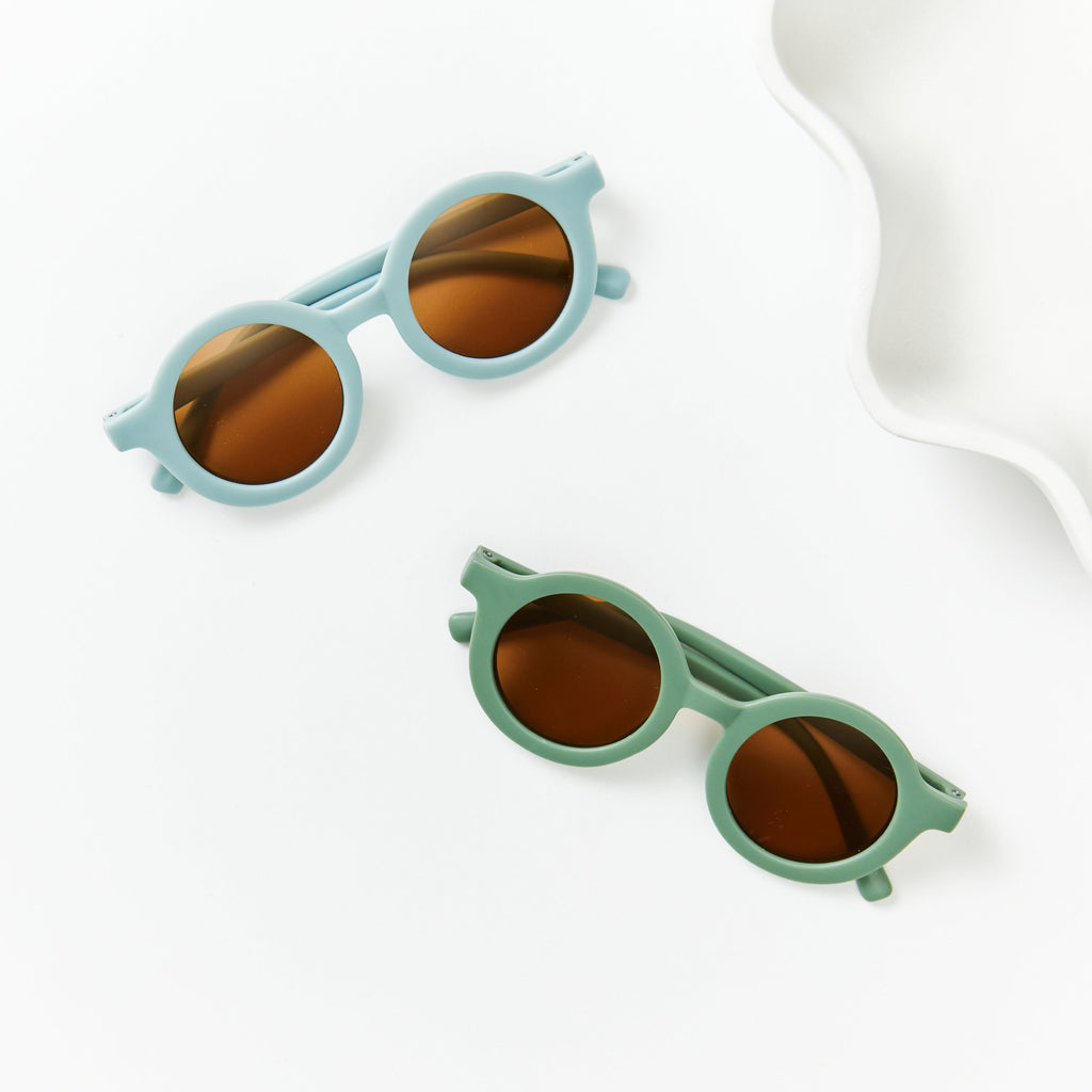 Ivory Leopard Ava Baby Sunglasses — close-up of leopard print on baby sunglasses