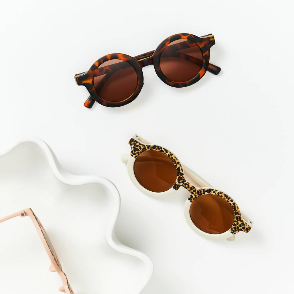 Toddler wearing baby sunglasses in sunlight — Matte Latte Ava Baby Sunglasses