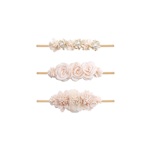 Three champagne and nude rose pearl baby headbands from the Lark champagne set