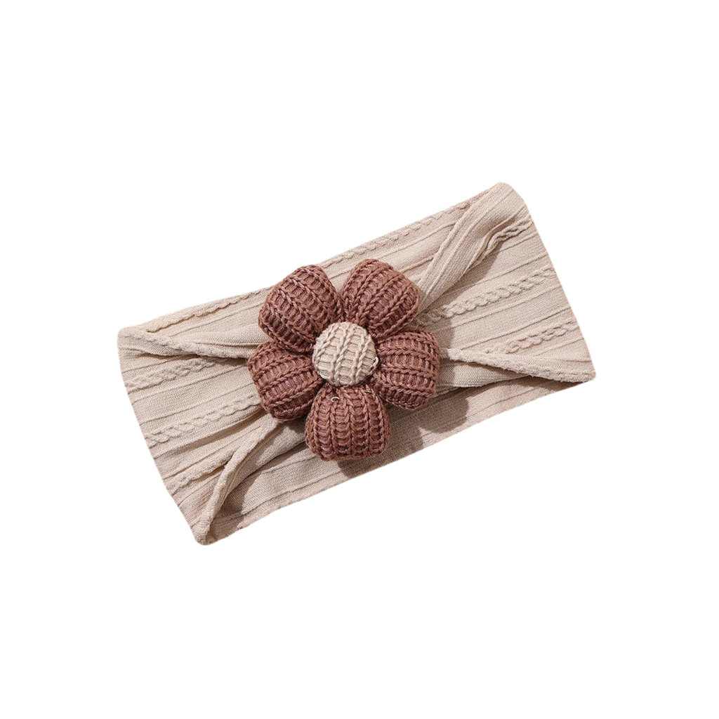 Sienna knitted flower on sand cable knit baby headband on white background