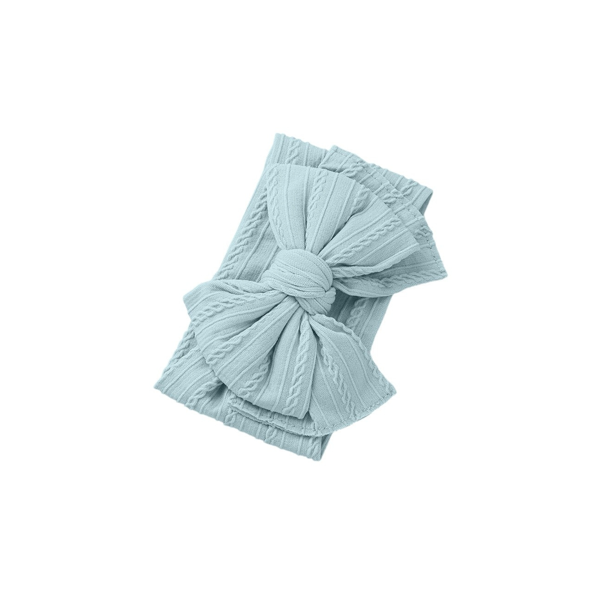Bowie Cable Knit Double Bow Headband — baby headband styled flat lay with nursery accessories