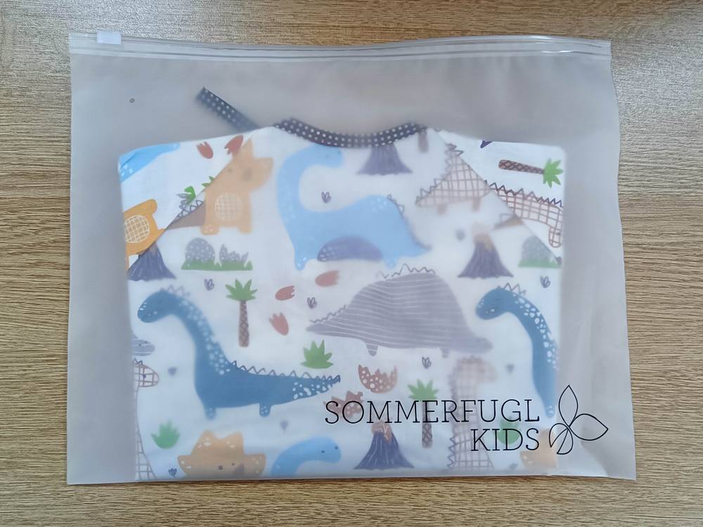 Dinosaur Friends Waterproof Baby Smock Bib Long Sleeve — dinosaur baby bib showing face and soft texture