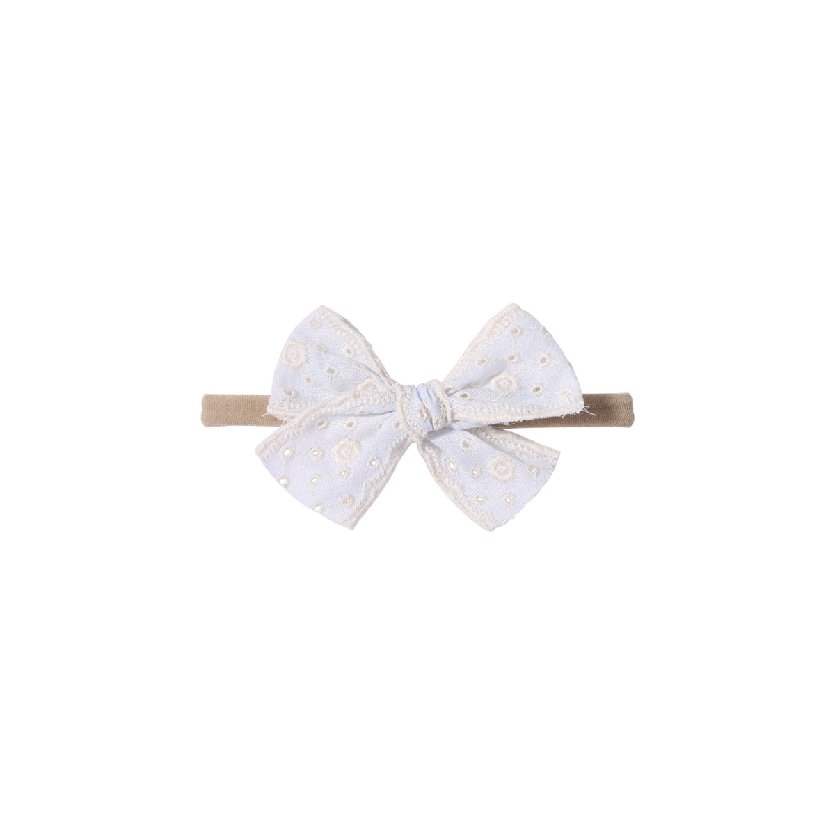 Dorothea eyelet baby bow headband in white, thick broderie anglaise bow with embroidered flower eyelets and scalloped edges on a soft nylon band, Sommerfugl Kids