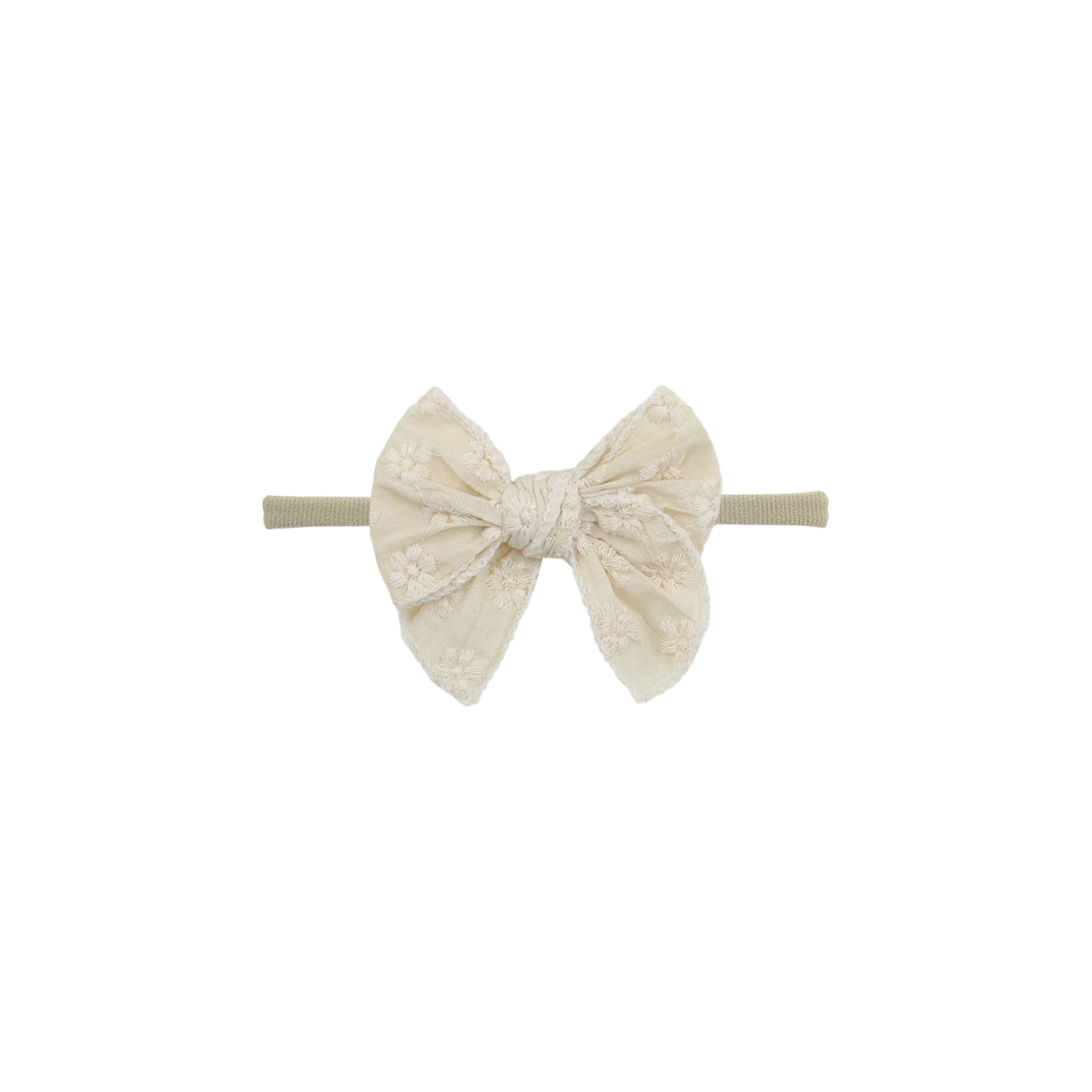 Frankie baby bow headband in cream eyelet, an oversized bow on a thin nylon band