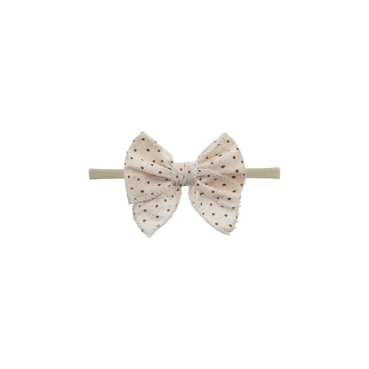 Frankie baby bow headband in cream speckle, an oversized bow on a thin nylon band