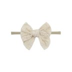 Cream eyelet oversized bow baby headband on thin nylon band