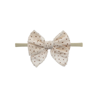 Cream speckle print oversized bow baby headband on thin nylon band
