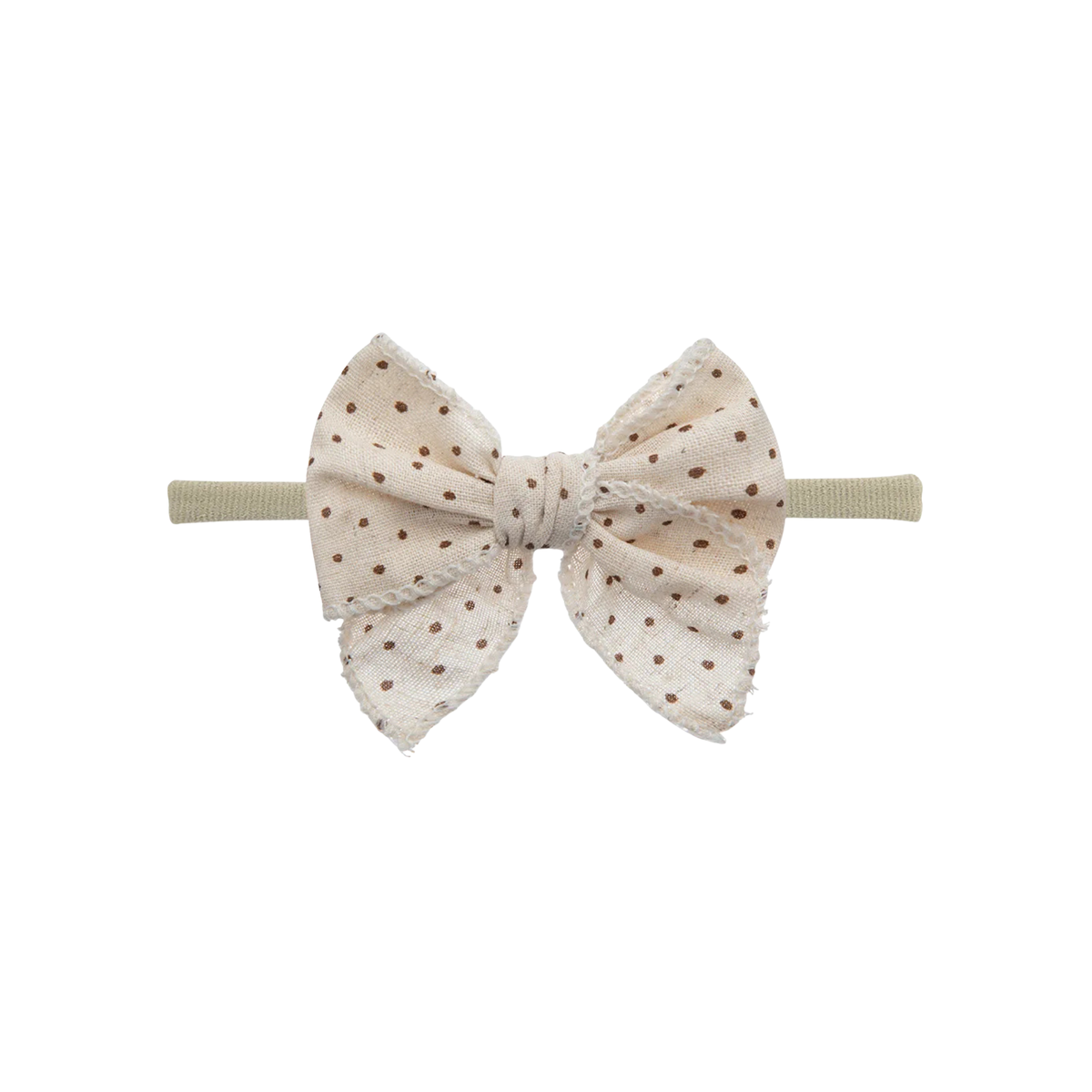 Cream speckle print oversized bow baby headband on thin nylon band