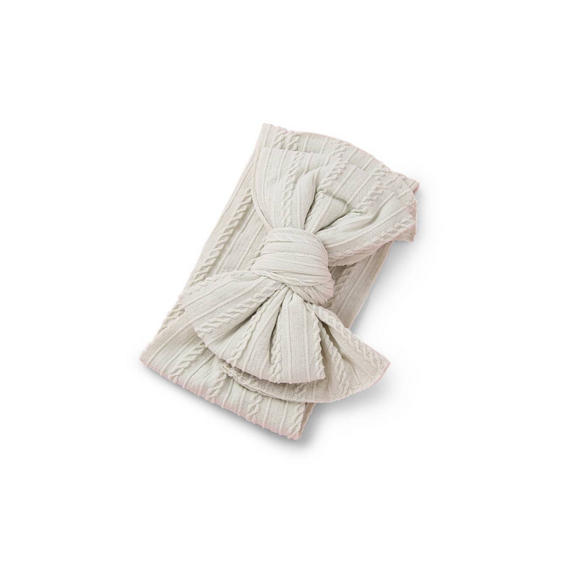 ivory ribbed knit baby headband with re-tieable oversized double bow, designed for newborns and toddlers