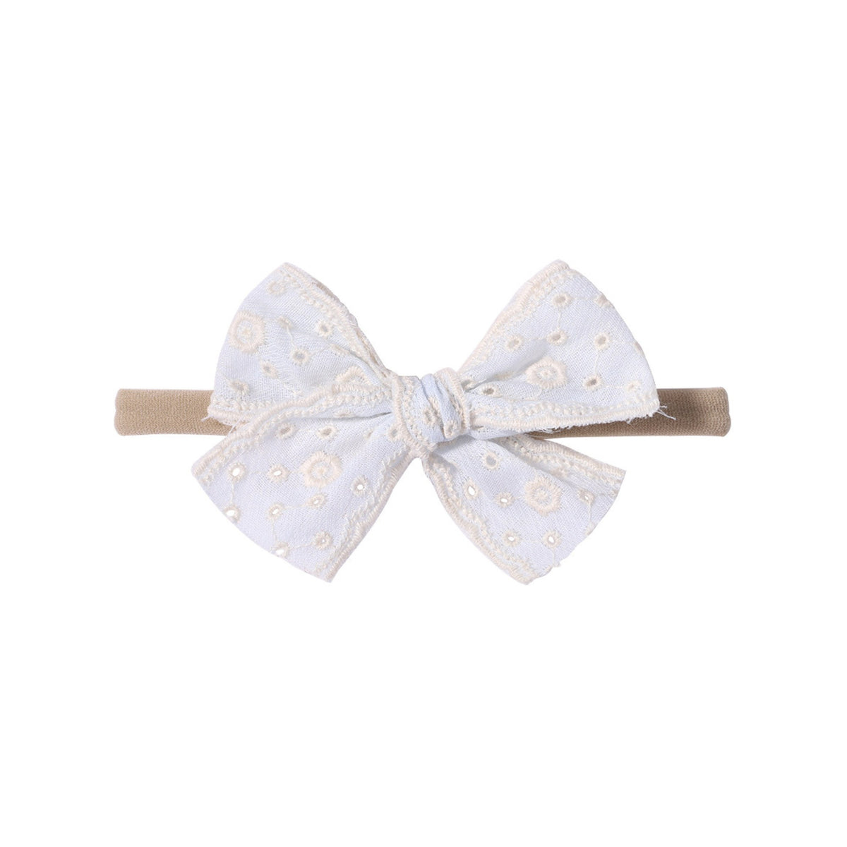 Lacey eyelet baby bow headband in white, broderie anglaise bow with cream embroidered eyelets and scalloped edges on a soft nylon band, Sommerfugl Kids