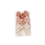Rosewood baby hair clip 3-pack with rose, oat and blush fabric bows on display card