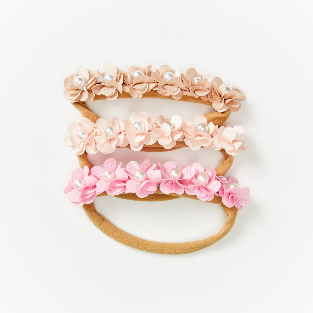 Three Opal pearl flower baby headbands stacked in nude, blush and pink, fabric flowers with faux pearl centres on soft nylon bands, Sommerfugl Kids