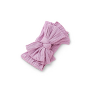 orchid purple ribbed knit baby headband with re-tieable oversized double bow, designed for newborns and toddlers
