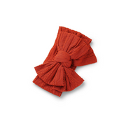 rouge red ribbed knit baby headband with re-tieable oversized double bow, designed for newborns and toddlers