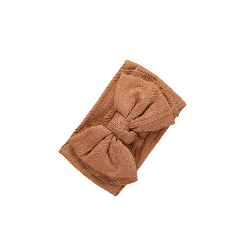 Bowie Double Bow baby headband in Rust , soft ribbed knit with re-tieable double bow