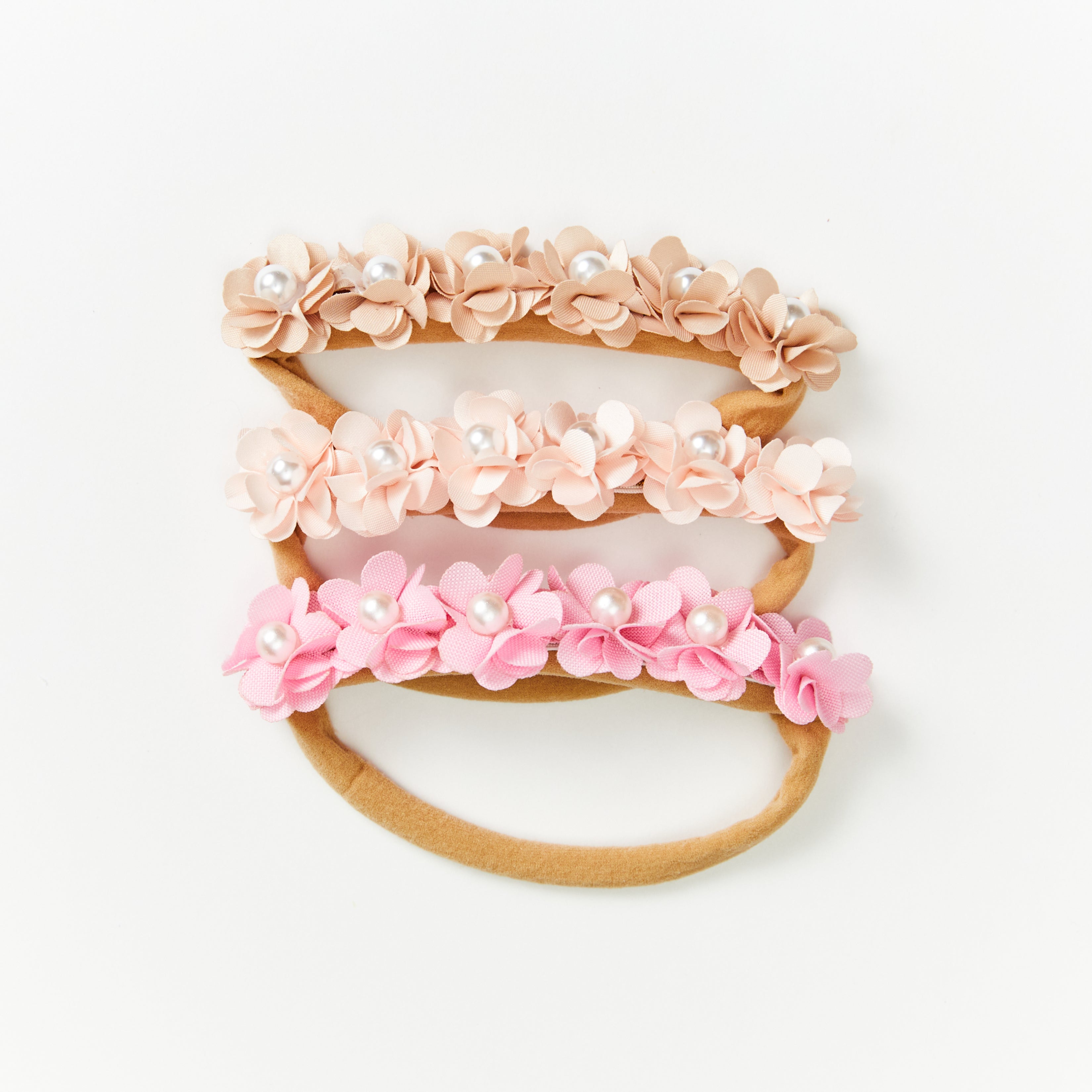 Delicate Baby Flower Crown with Pearls: Sunset Snow Flower Girl Headband — close-up of floral on baby headband