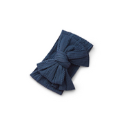 ribbed knit baby headband with re-tieable oversized double bow, designed for newborns and toddlers