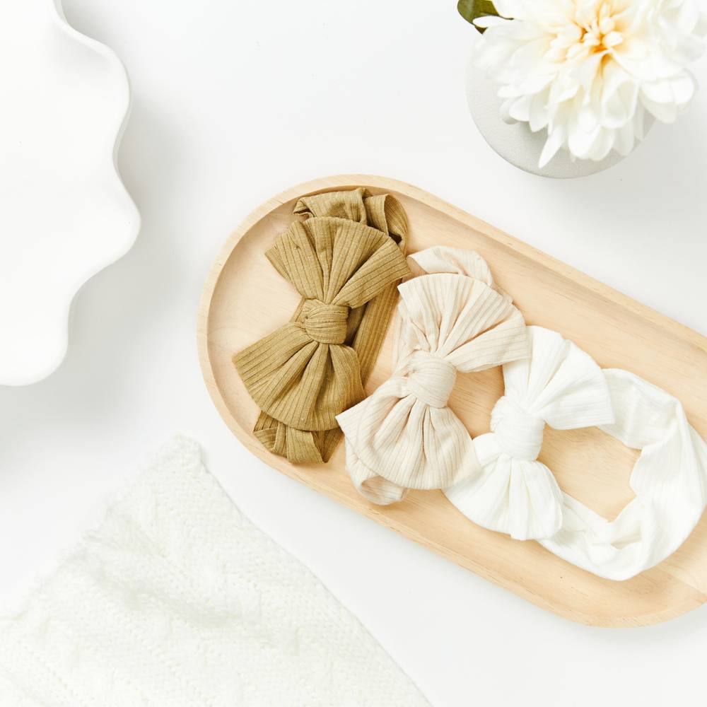 Bambi Soft Bow Headband in White — baby headband close-up showing nylon