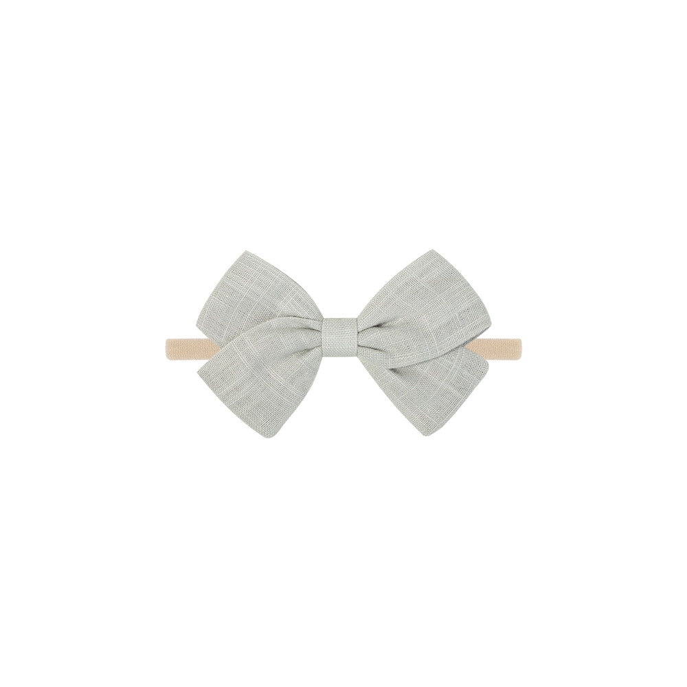 Tinka tiny bow baby headband in beige