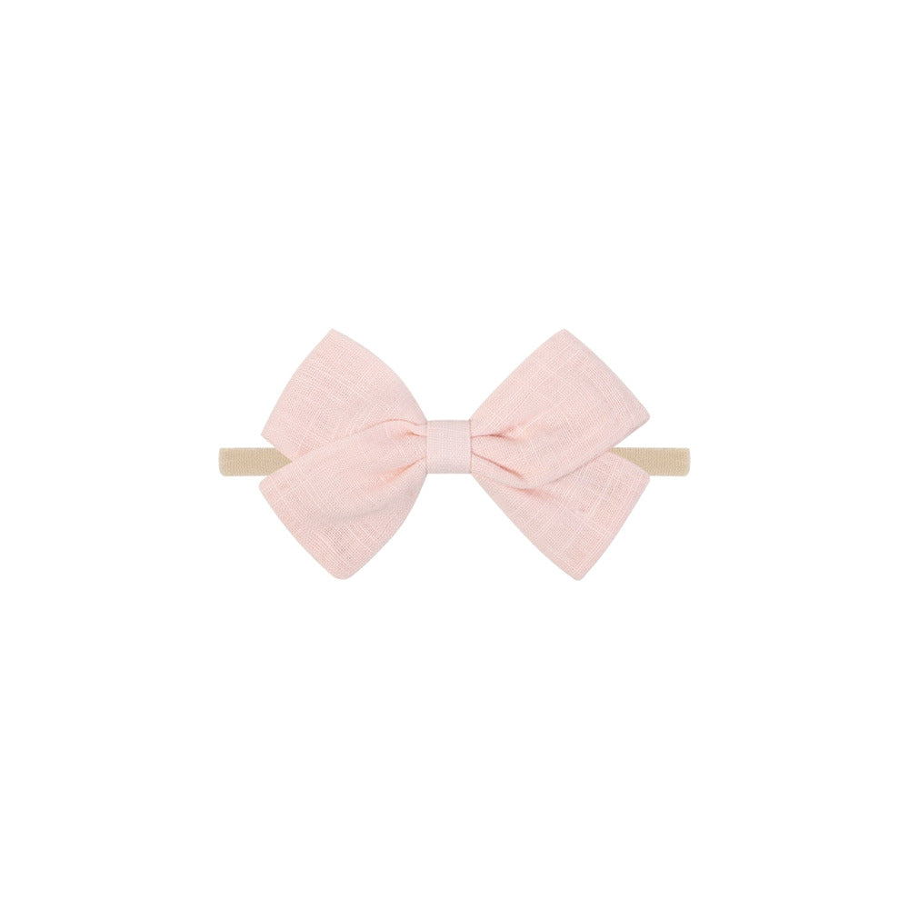 Tinka tiny bow baby headband in blush