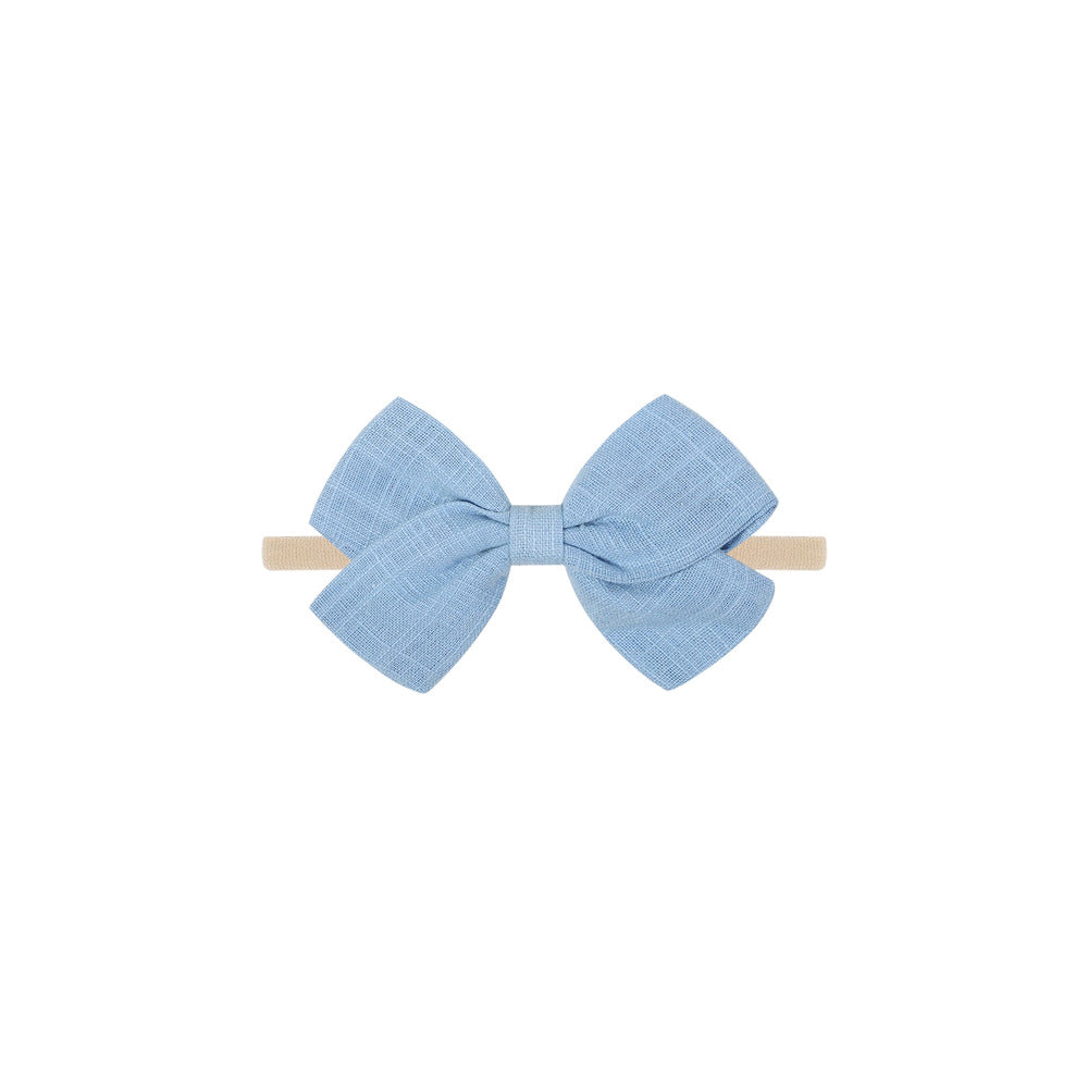 Tinka tiny bow baby headband in cornflower blue