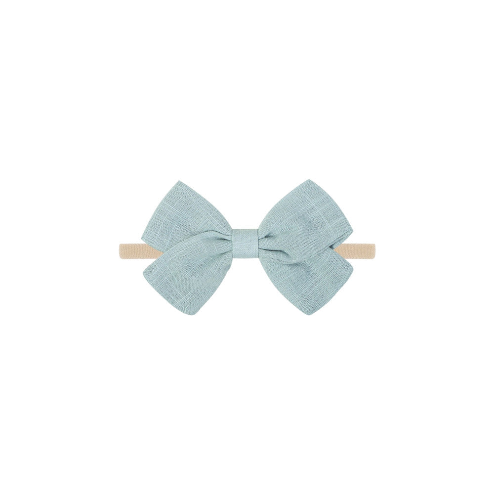 Tinka tiny bow baby headband in cruise blue