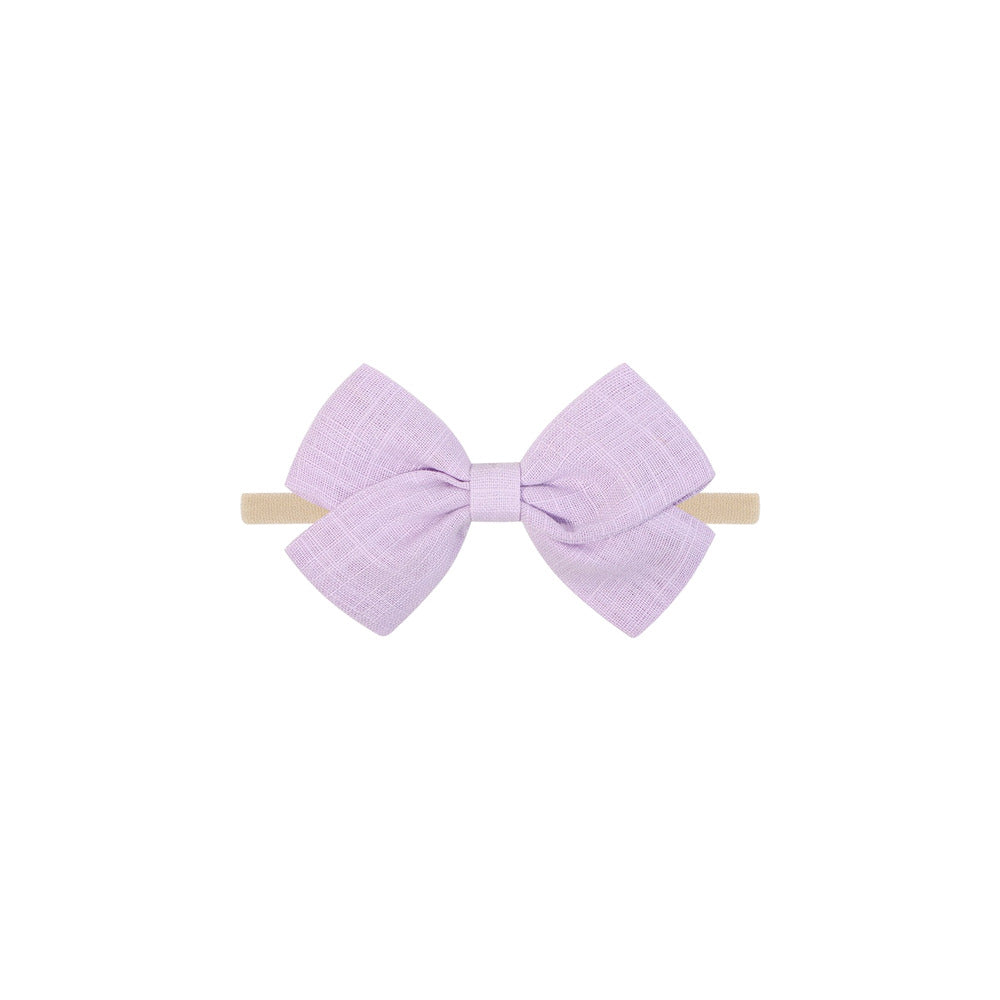 Tinka tiny bow baby headband in lilac