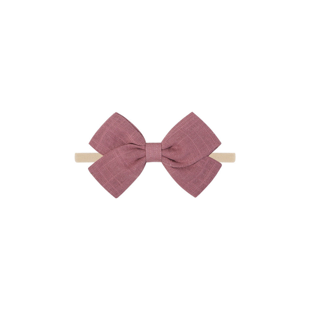 Tinka tiny bow baby headband in magenta