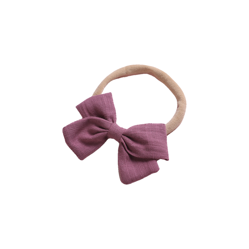 Tinka tiny bow baby headband in mauve