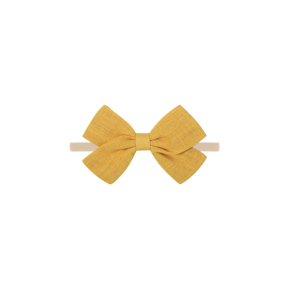 Tinka tiny bow baby headband in mustard