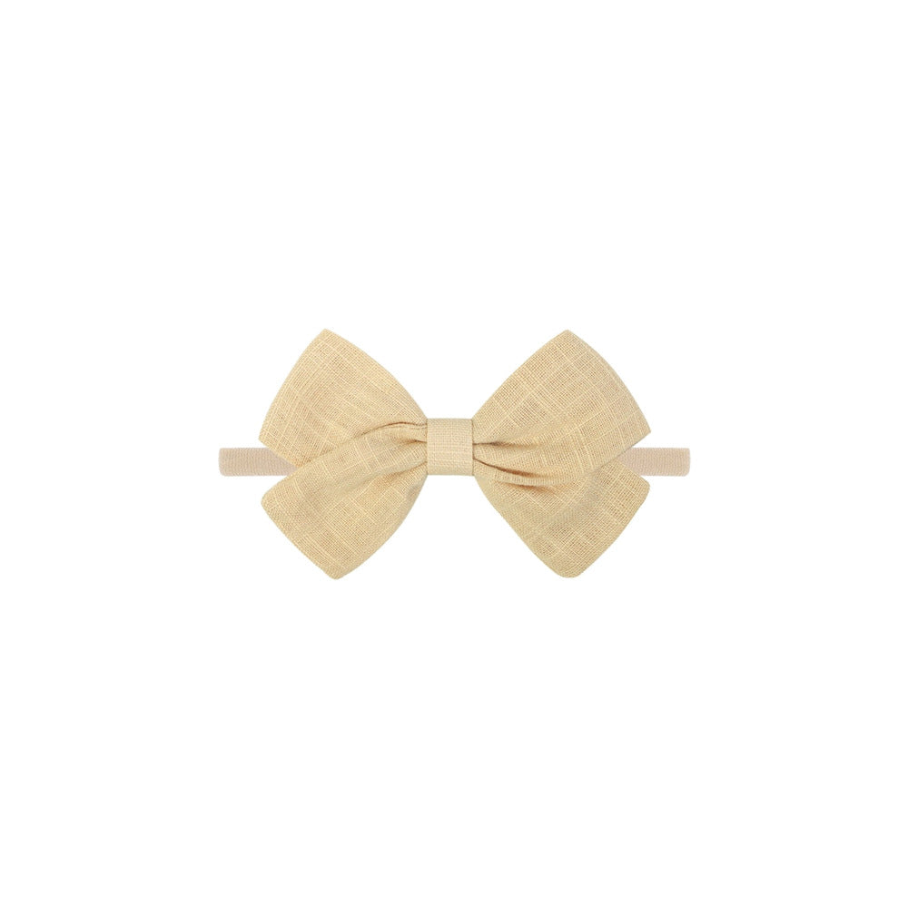 Tinka tiny bow baby headband in oat