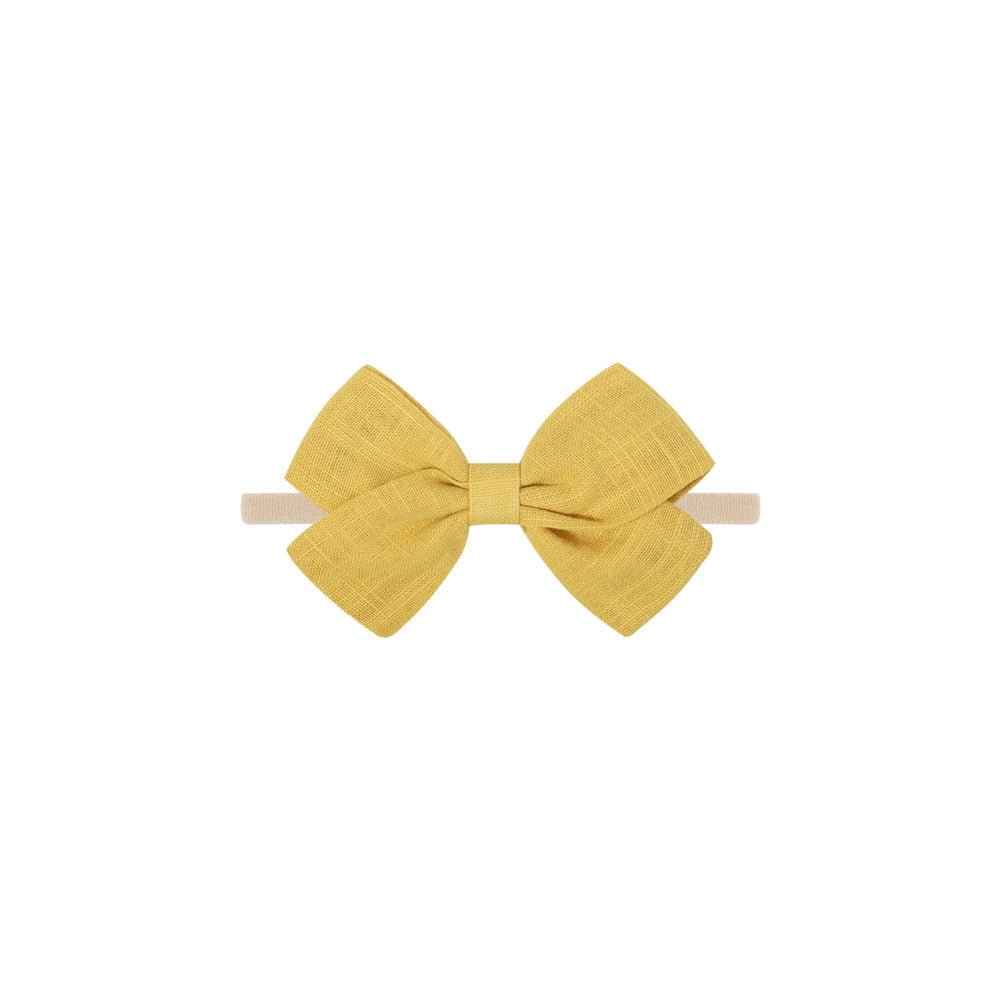 Tinka tiny bow baby headband in old gold