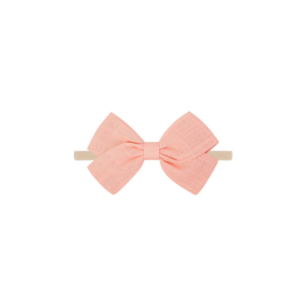 Tinka tiny bow baby headband in peach