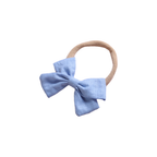 Tinka tiny bow baby headband in powder blue