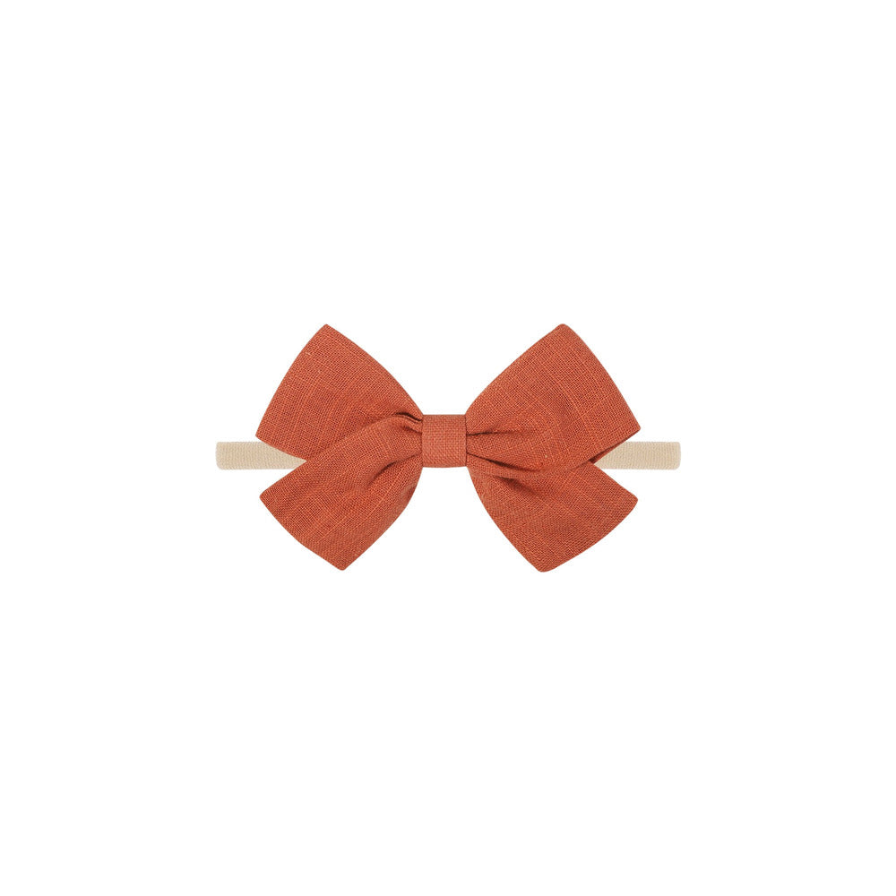 Tinka tiny bow baby headband in rouge