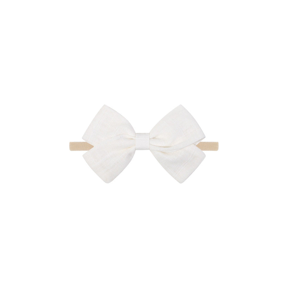 Tinka tiny bow baby headband in white