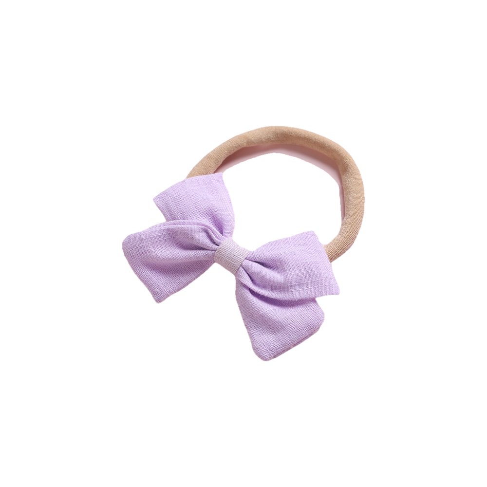 Tinka tiny bow baby headband in wisteria